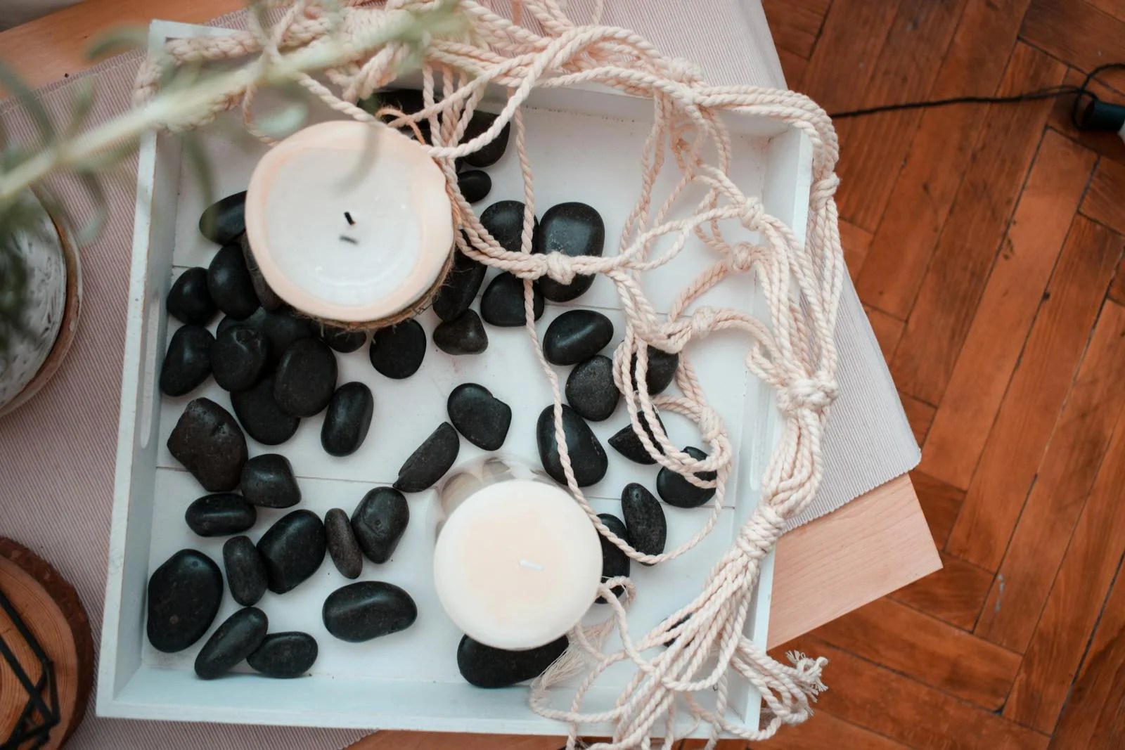 Home decoration with candles and black stones